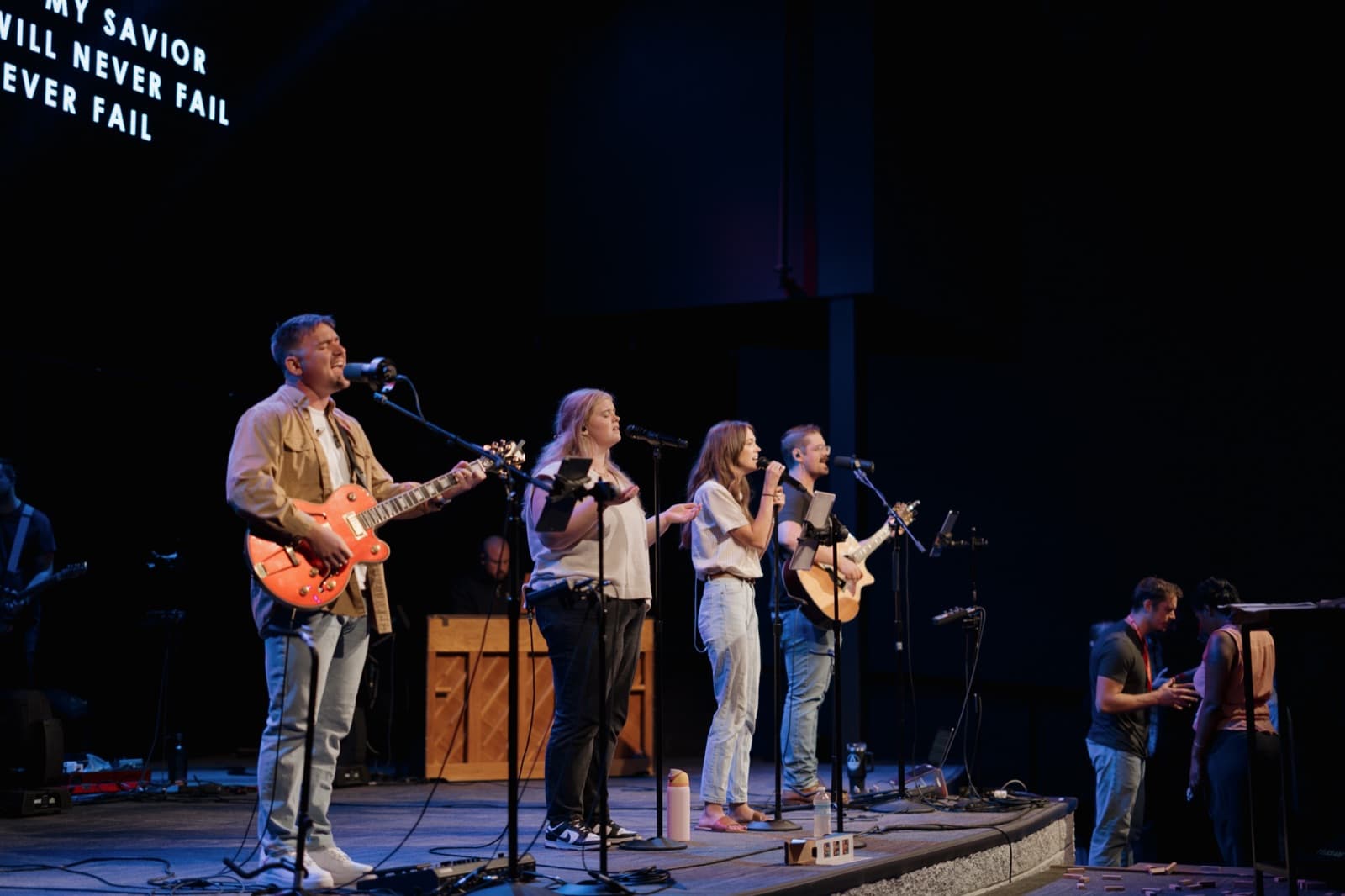 Young leaders leading worship on stage